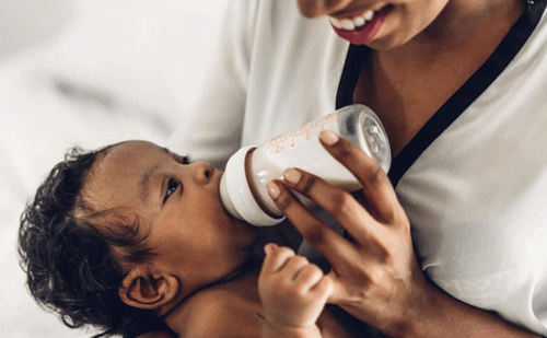 Baby drinking milk from a bottle